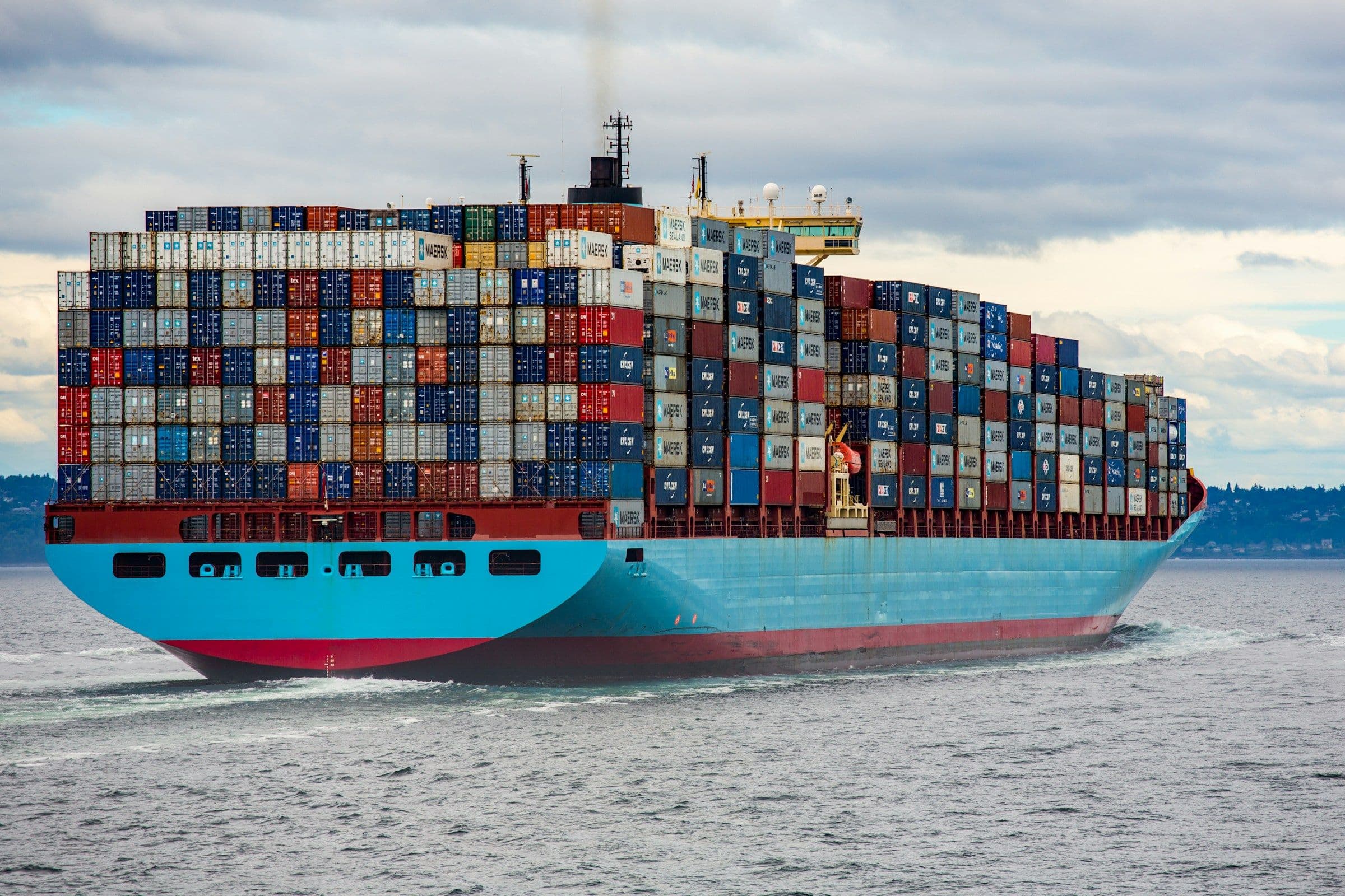 Container ship carrying international cargo across open water