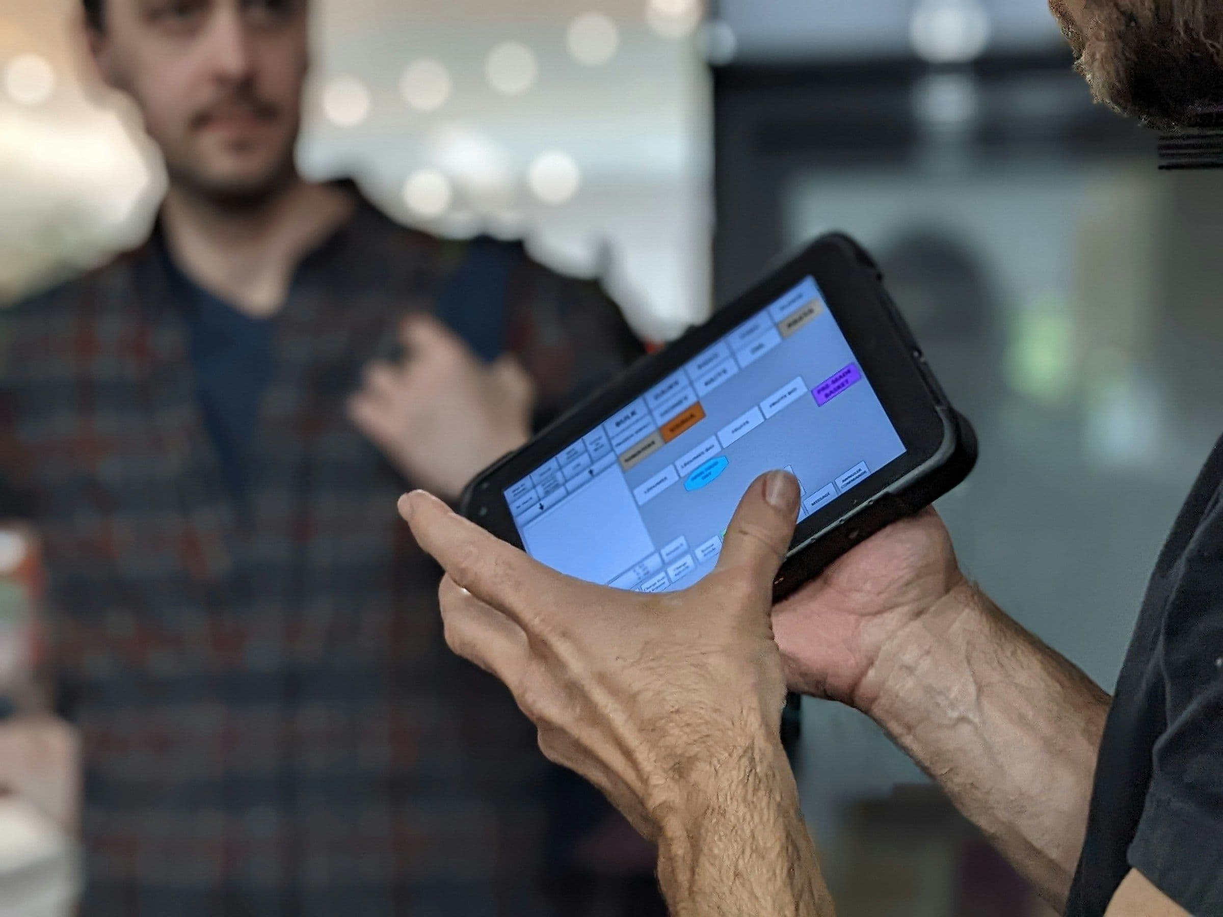 Operator reviewing a digital workflow timeline on a tablet