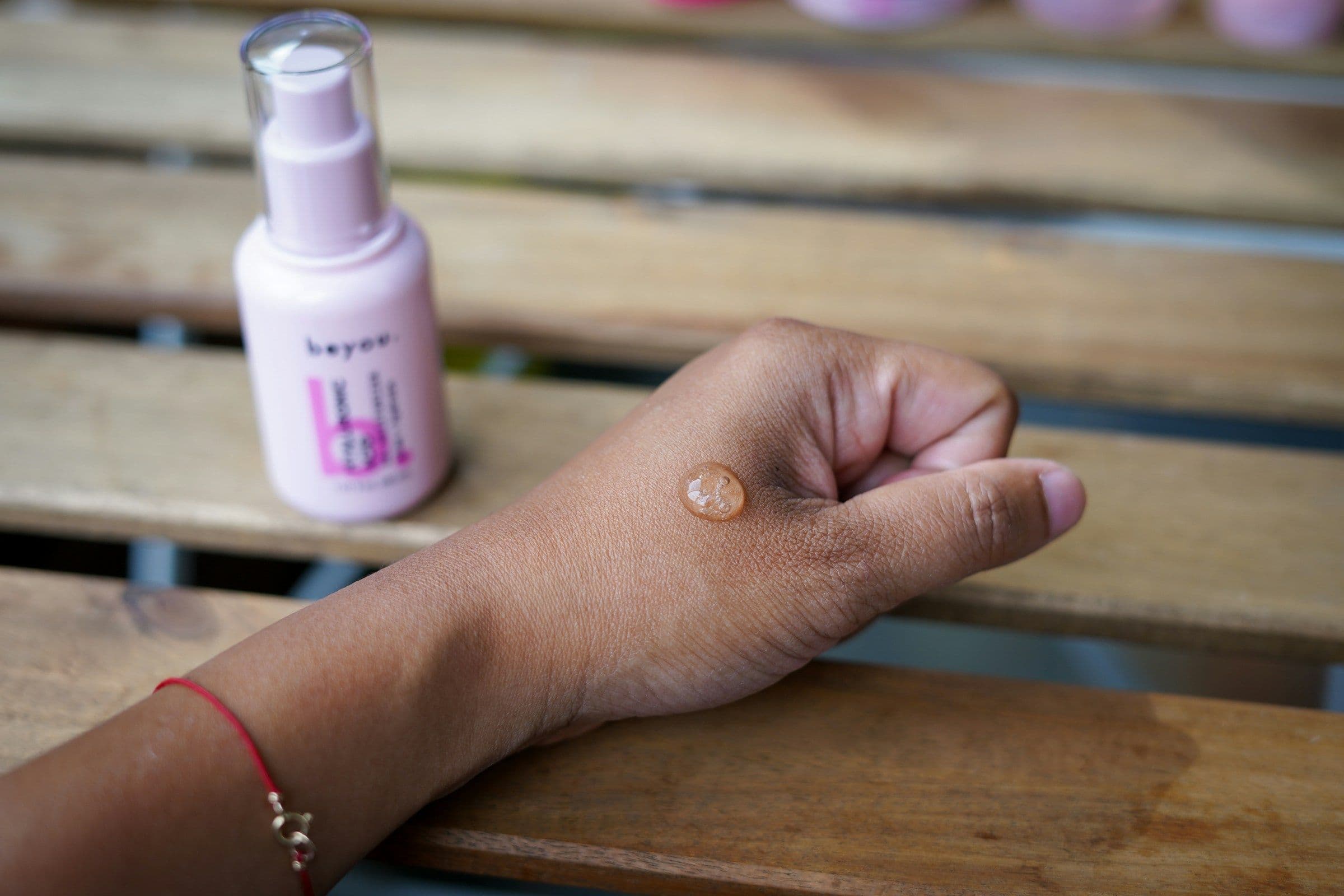 Customer testing a skincare moisturizer on the back of her hand