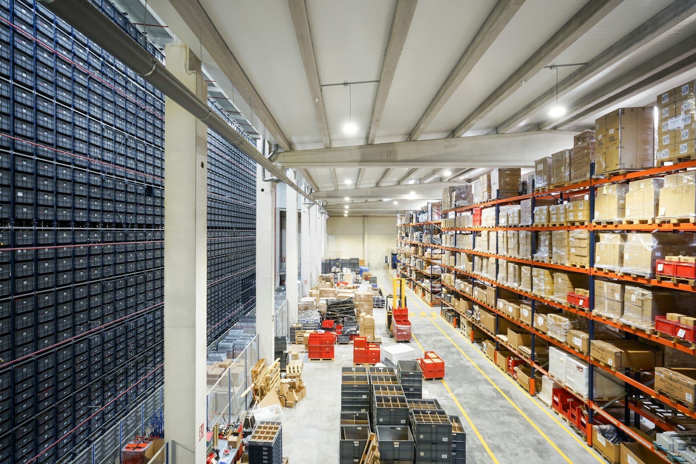 Wide view of a warehouse with palletized inventory on high shelves
